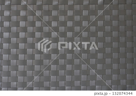 Handmade weave pattern of gray plastic strips texture for mats, baskets or rattan furniture. Handmade weave pattern of gray plastic strips texture for mats, baskets or rattan furniture. 132074344