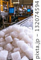Sugar cubes on conveyor belt in modern food processing factory 132074594