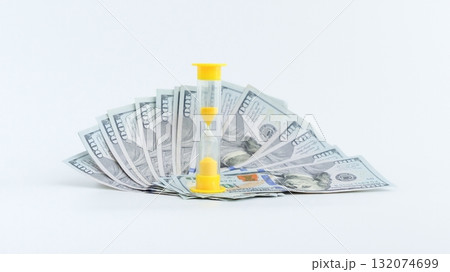 Time is Money Hourglass on a Pile of Hundred Dollar Bills, Financial Planning Concept 132074699