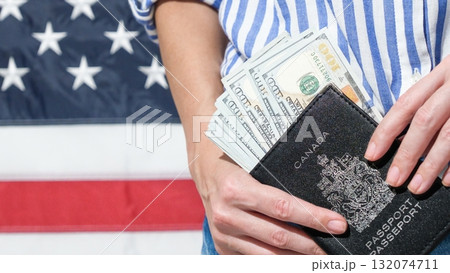 Canadian Passport and US Dollars with American Flag for Travel Preparations Planning Canadian Passport and US Dollars with American Flag for Travel Preparations Planning 132074711
