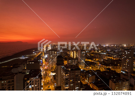 Night view of the city of Lima in the municipality of San Miguel. Night view of the city of Lima in the municipality of San Miguel. 132074891