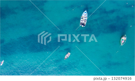 People practicing paddleboarding on the sea People practicing paddleboarding on the sea 132074916