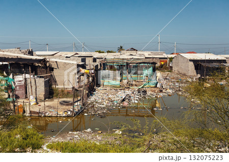 Unhygienic conditions and temporary homes in a slum on Isla del Rosario, Magdalena, Colombia. Unhygienic conditions and temporary homes in a slum on Isla del Rosario, Magdalena, Colombia. 132075223