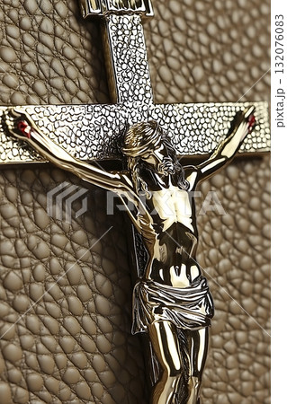 Gold cross with a man in the middle of it 132076083