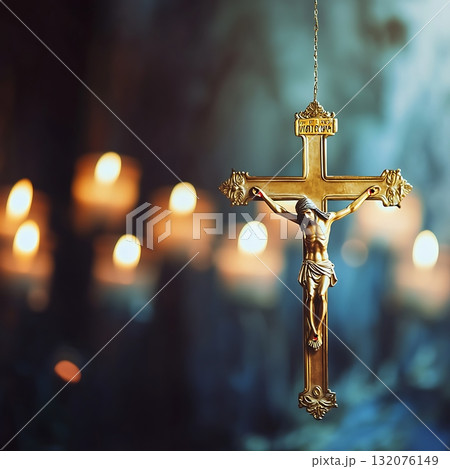 Gold cross with the name of Jesus Christ hanging from a string 132076149