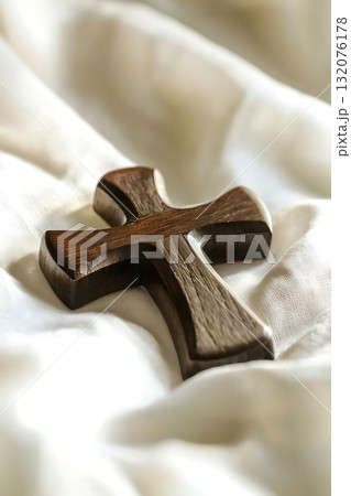 Wooden cross is on a white cloth Wooden cross is on a white cloth 132076178