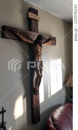 Wooden cross with a statue of Jesus Christ on it 132076183