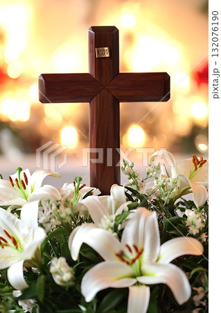 Wooden cross is placed on top of a bouquet of white lilies Wooden cross is placed on top of a bouquet of white lilies 132076190