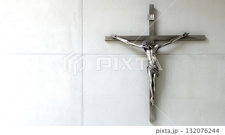 Silver cross with a man in the middle of it 132076244