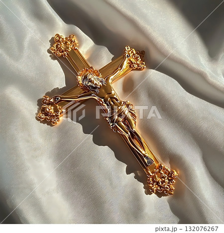 Gold cross with a man on it 132076267
