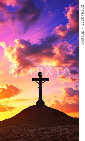 Cross is on top of a hill with a beautiful sunset in the background 132076332