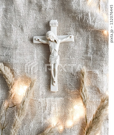 White cross with a man in the middle of it 132076445