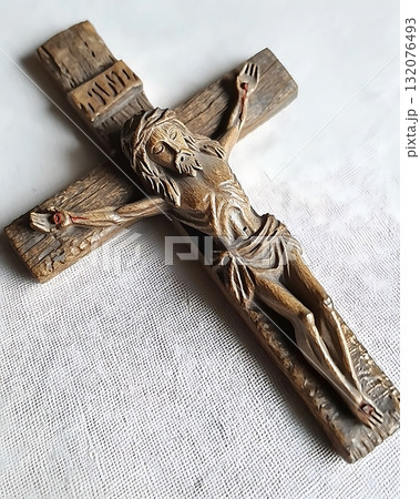 Wooden cross with a man on it 132076493