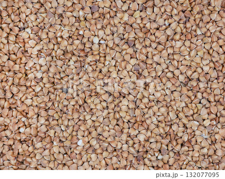 A close-up view of buckwheat. The textured abstract background 132077095