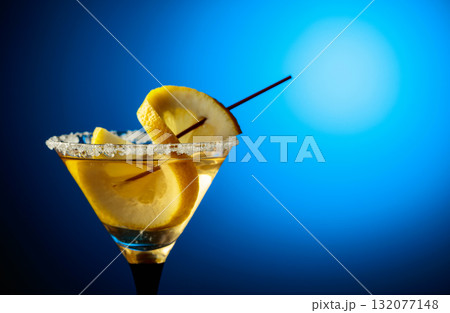 Glass of Martini with lemon slice. Glass of Martini with lemon slice. 132077148