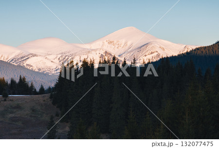 Scenic image of snowy peaks in the sunlight. Location Carpathian national park. 132077475