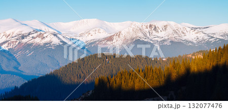 Scenic image of snowy peaks in the sunlight. Location Carpathian national park. 132077476