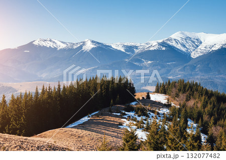 Scenic image of snowy peaks in the sunlight. Location Carpathian national park. Scenic image of snowy peaks in the sunlight. Location Carpathian national park. 132077482