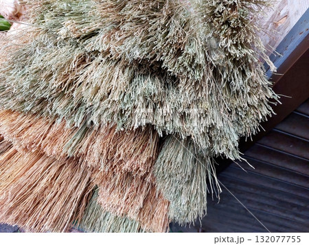 Sorghum Brooms Displayed for Sale in a Local Market in a Rural Setting 132077755