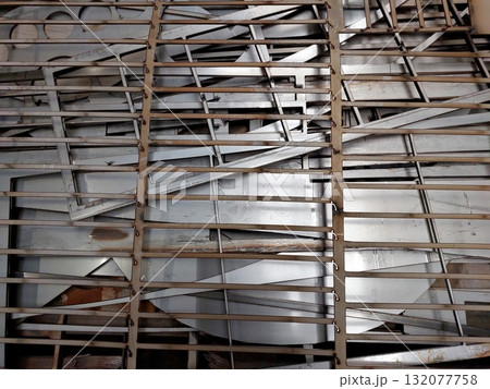 Waste Metal Sheets Stacked After Plasma Cutting in a Workshop Setting 132077758