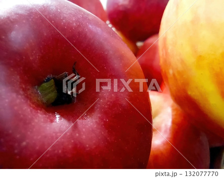 Fresh Red Apples Stacked Together in a Bright, Colorful Display at a Local Market 132077770