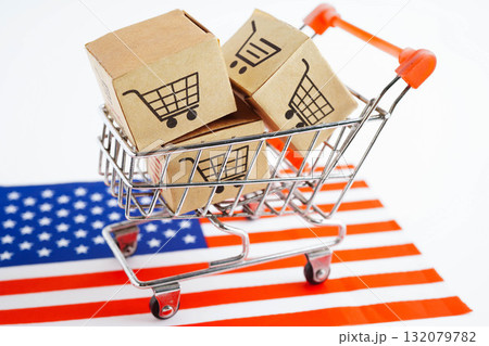 Online shopping, Shopping cart box on US America flag, import export, finance commerce. Online shopping, Shopping cart box on US America flag, import export, finance commerce. 132079782