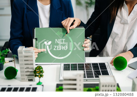 Business people having consultation about wind energy at company office. Business team discussing about windmill and alternative green energy. 132080488