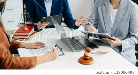 business people and lawyers discussing contract papers sitting at the table. Concepts of law, advice, legal services. 132080495