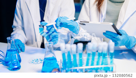 Scientist team meeting and writing analysis results in the laboratory study and analyze scientific Scientist team meeting and writing analysis results in the laboratory study and analyze scientific 132080562