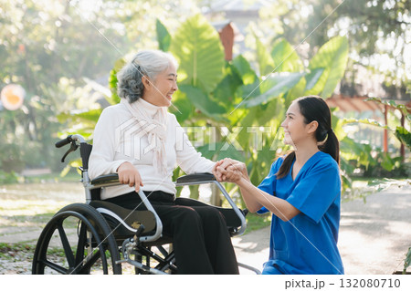 Elderly asian senior woman on wheelchair with Asian careful caregiver. Nursing home hospital 132080710