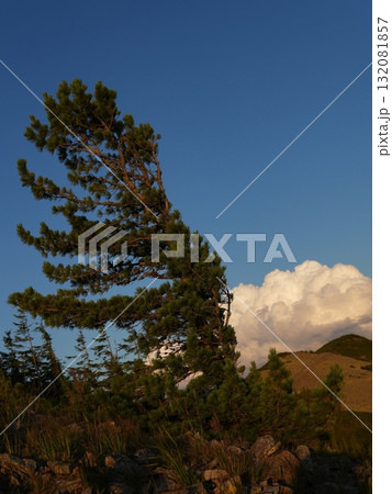Beautiful mountain landscape, light over peaks and valleys, natural scenery, calm atmosphere and wild nature Beautiful mountain landscape, light over peaks and valleys, natural scenery, calm atmosphere and wild nature 132081857