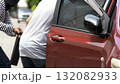thief stealing a briefcase from a man near a red car, representing street crime, danger, and theft in urban areas. Concept of robbery, loss prevention, and personal safety awareness in public 132082933