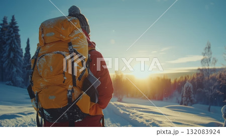 Embracing Winter s Solitude Hiker with Backpack Gazing at Sunset over Snow Covered Landscape Embracing Winter s Solitude Hiker with Backpack Gazing at Sunset over Snow Covered Landscape 132083924