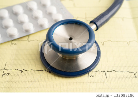 Stethoscope on electrocardiogram ECG with drug, heart wave, heart attack, cardiogram report. 132085186