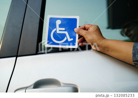 Wheelchair sticker sign on car for safety travel. 132085233