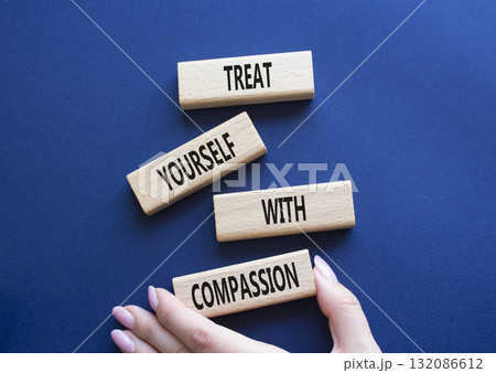 Treat yourself with compassion symbol. Concept words Treat yourself with compassion on wooden blocks. Beautiful deep blue background. Doctor hand. Medicine concept. Copy space. Treat yourself with compassion symbol. Concept words Treat yourself with compassion on wooden blocks. Beautiful deep blue background. Doctor hand. Medicine concept. Copy space. 132086612