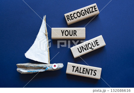 Unique Talents symbol. Concept words Recognize Your Unique Talents on wooden blocks. Beautiful deep blue background with boat. Business concept. Copy space Unique Talents symbol. Concept words Recognize Your Unique Talents on wooden blocks. Beautiful deep blue background with boat. Business concept. Copy space 132086616