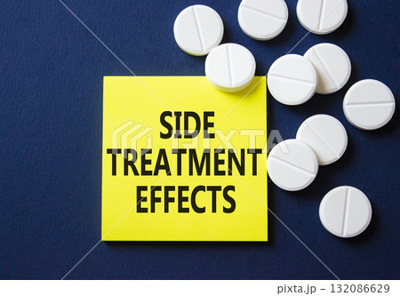 Side Treatment Effects symbol. Concept words Side Treatment Effects on yellow note. Beautiful deep blue background with pills. Healthcare and Side Treatment Effects concept. Copy space. Side Treatment Effects symbol. Concept words Side Treatment Effects on yellow note. Beautiful deep blue background with pills. Healthcare and Side Treatment Effects concept. Copy space. 132086629