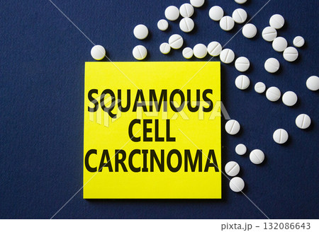 Squamous Cell Carcinoma symbol. Concept words Squamous Cell Carcinoma on yellow note. Beautiful deep blue background with pills. Healthcare and Squamous Cell Carcinoma concept. Copy space. Squamous Cell Carcinoma symbol. Concept words Squamous Cell Carcinoma on yellow note. Beautiful deep blue background with pills. Healthcare and Squamous Cell Carcinoma concept. Copy space. 132086643
