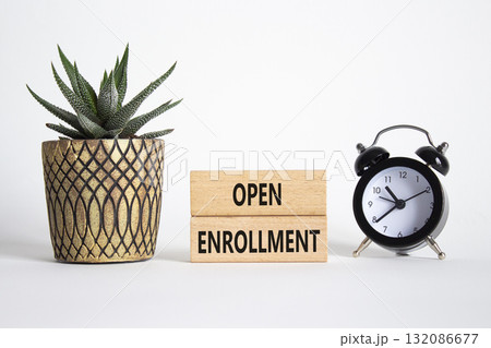 Open Enrollment symbol. Wooden blocks with words Open Enrollment. Beautiful white background with alarm clock and succulent plan. Business and Open Enrollment concept. Copy space. Open Enrollment symbol. Wooden blocks with words Open Enrollment. Beautiful white background with alarm clock and succulent plan. Business and Open Enrollment concept. Copy space. 132086677