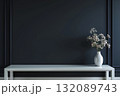 Elegant white table with a simple vase of flowers against a dark wall, creating a serene and stylish interior design atmosphere with modern aesthetics, with copyspace 132089743