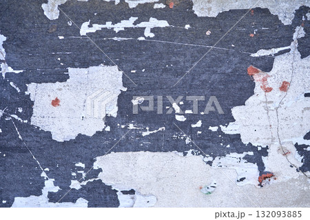 Close up of weathered peeling paint on a wall showing distressed texture Close up of weathered peeling paint on a wall showing distressed texture 132093885