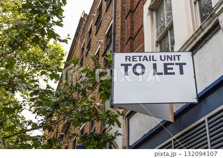 Retail Unit To Let sign on UK high street storefront, commercial property for rent 132094107