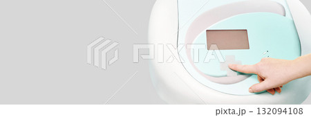 Hand adjusting settings on modern medical device with interactive display Hand adjusting settings on modern medical device with interactive display 132094108