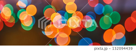 Vibrant out-of-focus multicolored lights in circular patterns creating Vibrant out-of-focus multicolored lights in circular patterns creating 132094439