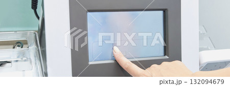 Close-up of caucasian female using touchscreen interface on technological 132094679