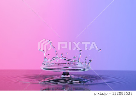 Water splash like umbrella on color background Water splash like umbrella on color background 132095525