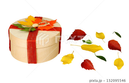 Beautiful gift box decorated with colorful autumn leaves, isolated on a transparent background 132095546