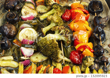Grilled skewers with vegetables on baking sheet. Grilled skewers with vegetables on baking sheet. 132095923