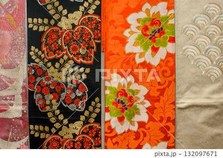 Colorful traditional silk fabrics of Japanese Kimono, featuring floral patterns and intricate designs 132097671